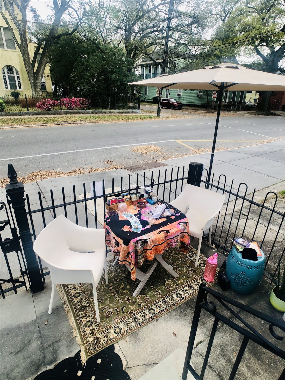 Gretta's oracle table set up under an umbrella on Magazine Street